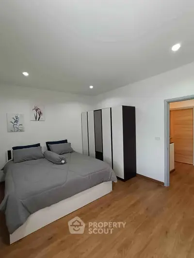 Modern bedroom with stylish decor and spacious wardrobe