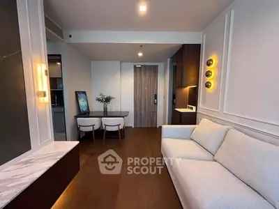 Modern living room with elegant decor and cozy seating area, perfect for relaxation and entertainment.
