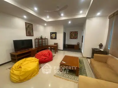 Spacious living room with modern decor and cozy seating area