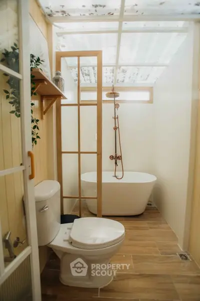 Charming bathroom with modern freestanding bathtub and wooden accents
