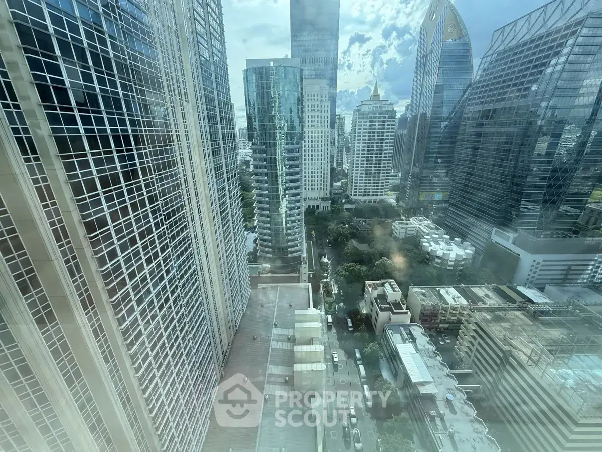 Stunning cityscape view from a high-rise building showcasing modern architecture and urban skyline.