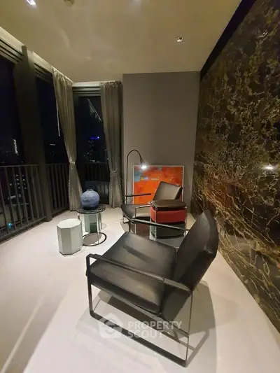 Luxurious modern living room with elegant decor and stunning night view.