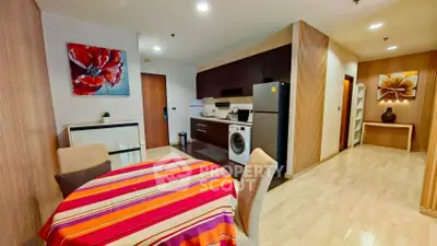 Modern open-layout kitchen and dining area with vibrant decor and appliances.