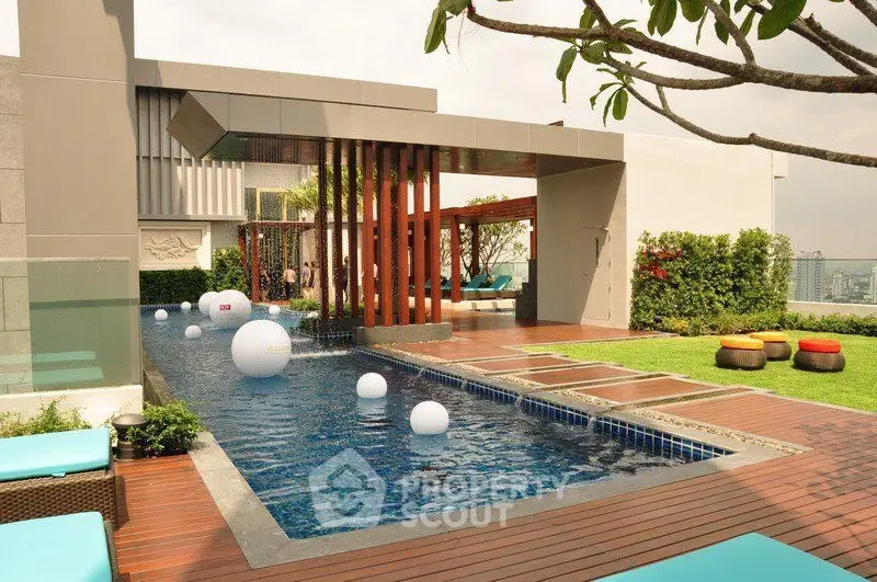 Luxurious rooftop pool with modern design and stunning city views, perfect for relaxation and entertainment.