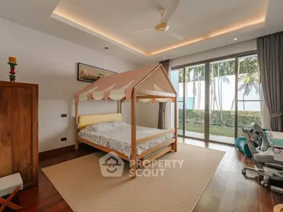 Charming bedroom with unique canopy bed and garden view, featuring modern decor and ample natural light.