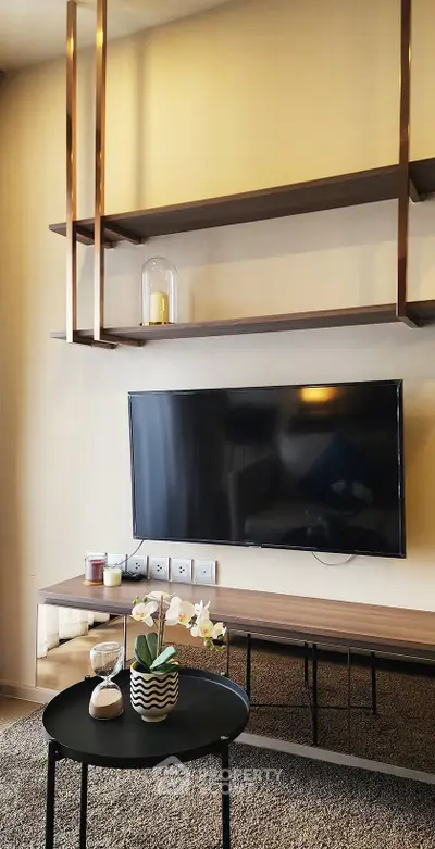 Modern living room with sleek TV setup and stylish shelving