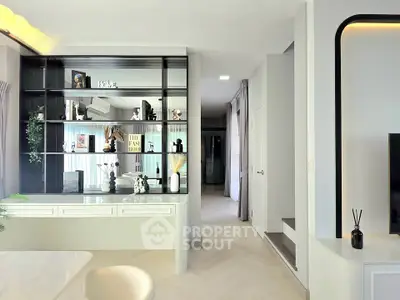 Modern living room with stylish shelving and elegant decor