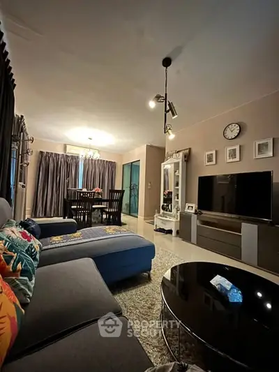 Spacious living room with modern decor and cozy seating area