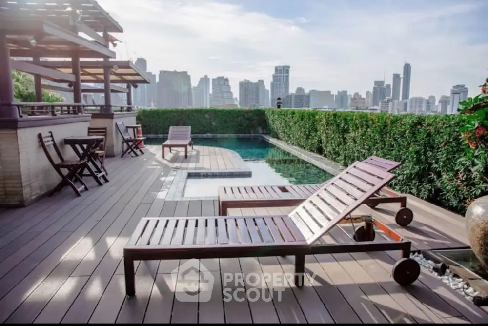 Luxurious rooftop pool with city skyline view and stylish wooden loungers