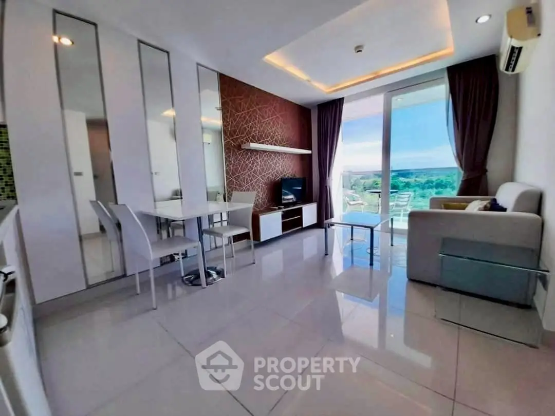 Modern living room with stylish decor and stunning balcony view