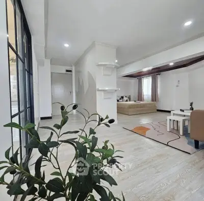 Spacious modern living room with stylish decor and natural light