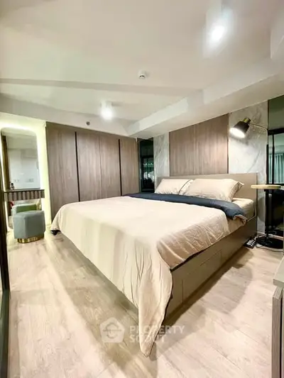 Luxurious modern bedroom with elegant lighting and spacious design