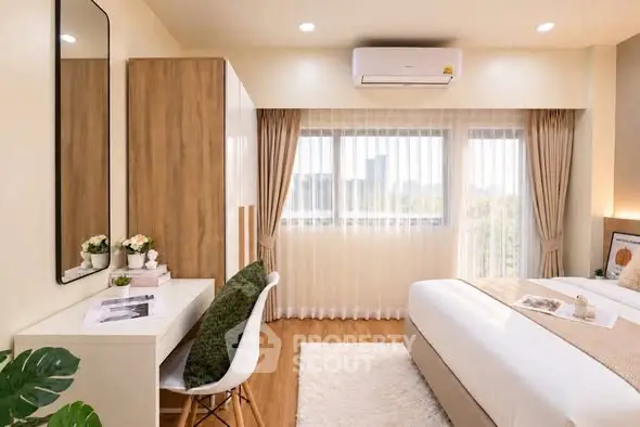 Bright and cozy bedroom with modern decor and large windows.