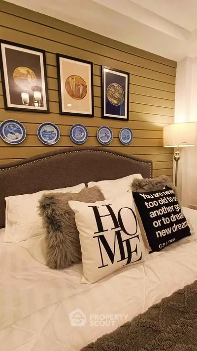 Cozy bedroom with stylish decor and plush pillows, perfect for relaxation and comfort.