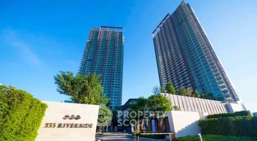 Stunning view of modern high-rise residential towers with lush greenery at 333 Riverside.