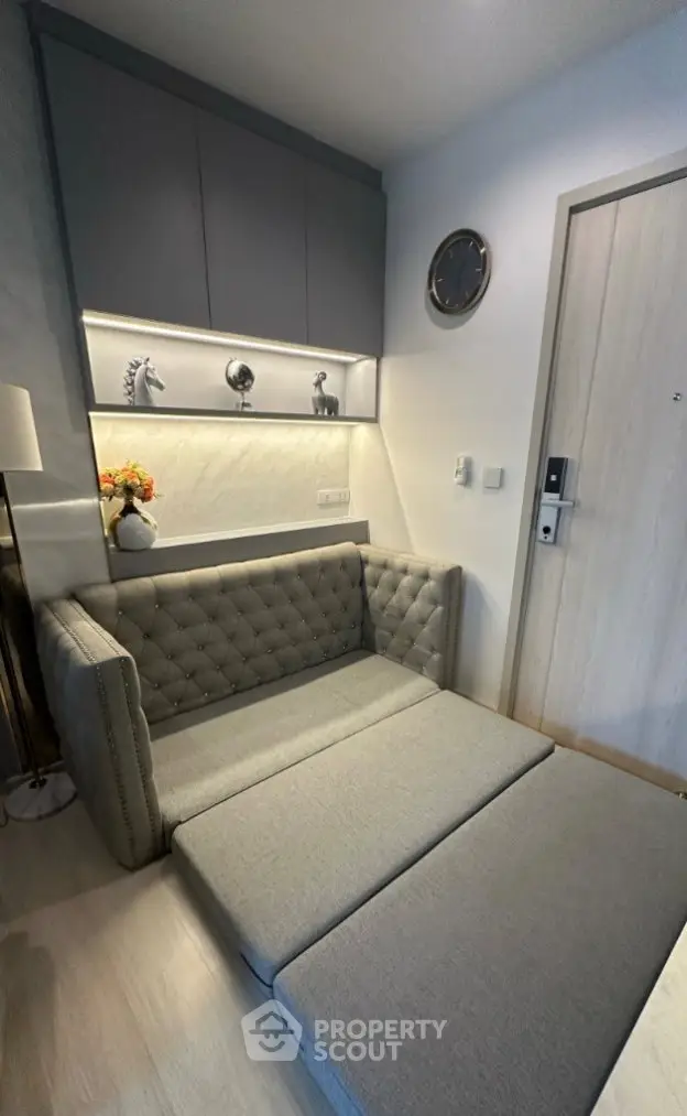 Stylish modern living room with elegant gray sofa and decorative accents