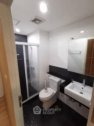 Modern bathroom with sleek shower and contemporary fixtures