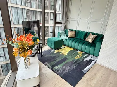 Luxurious living room with green velvet sofa and panoramic city view