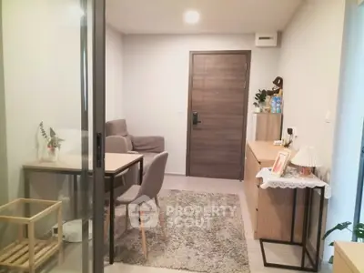 Cozy living room with modern furniture and stylish decor in a contemporary apartment.