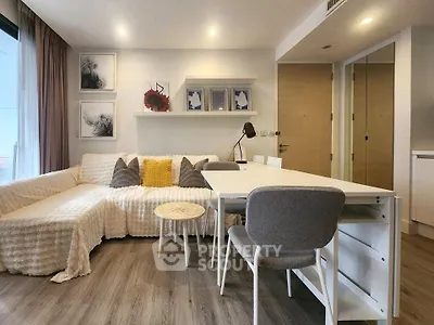 Modern living room with stylish decor and cozy seating area in a contemporary apartment.