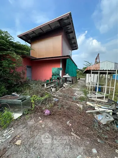 Explore potential with this fixer-upper property featuring a spacious lot and unique architectural design.