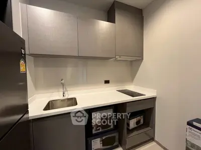 Modern kitchen with sleek cabinetry and built-in appliances