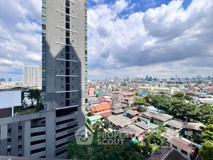 Stunning cityscape view from high-rise building with vibrant skyline and residential area below.