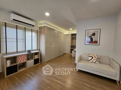 Spacious modern living room with wooden flooring and stylish decor