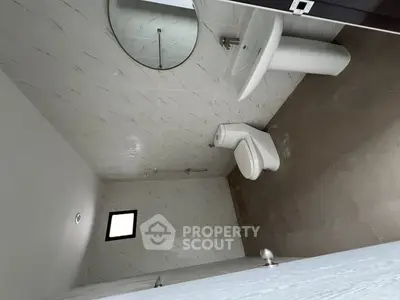 Modern bathroom with sleek fixtures and minimalist design.