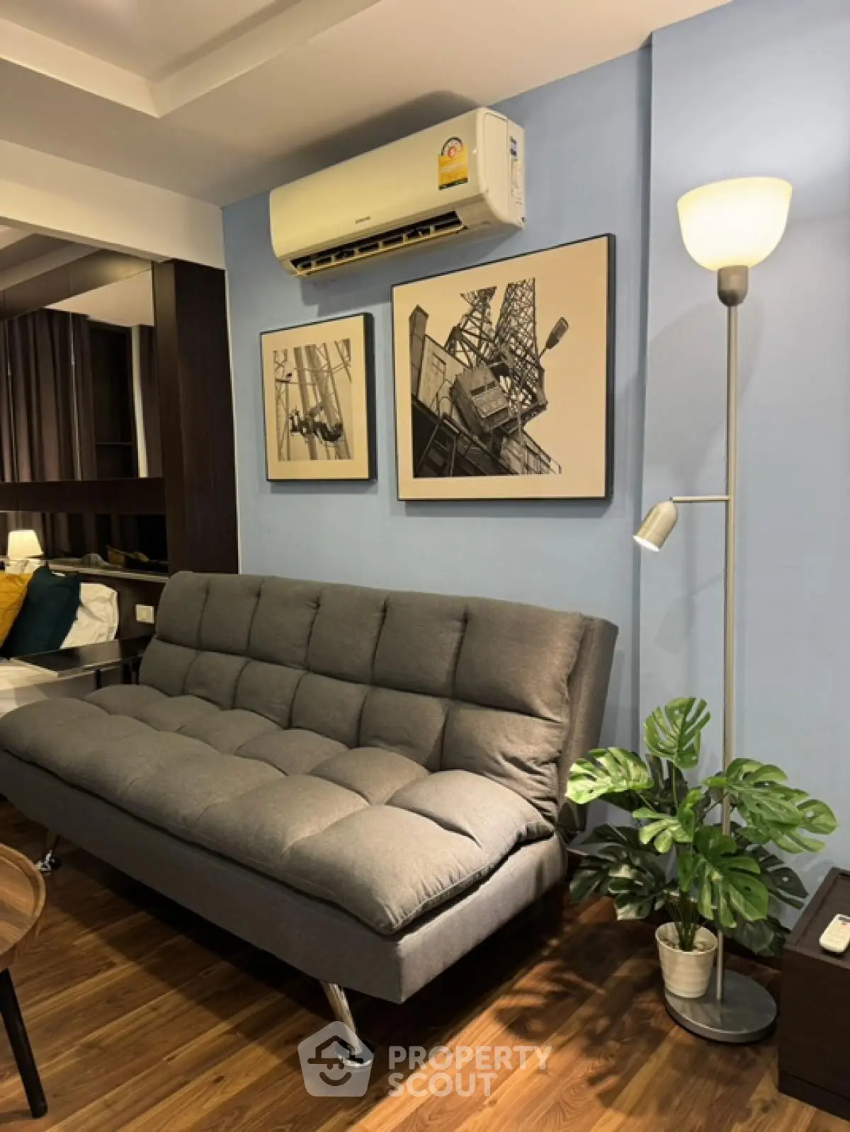 Modern living room with stylish gray sofa and elegant decor