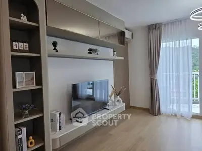 Modern living room with stylish decor and balcony view