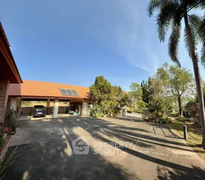 Spacious suburban property with solar panels and lush greenery