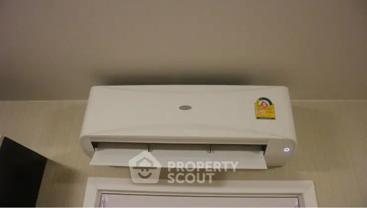 Modern wall-mounted air conditioning unit in a stylish interior setting.