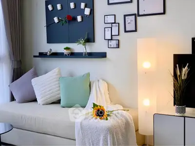 Chic modern living room with cozy sofa, stylish decor, and ambient lighting for a welcoming atmosphere.