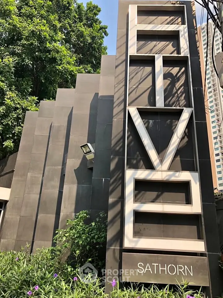 Modern building exterior with sleek architectural design in Sathorn area.