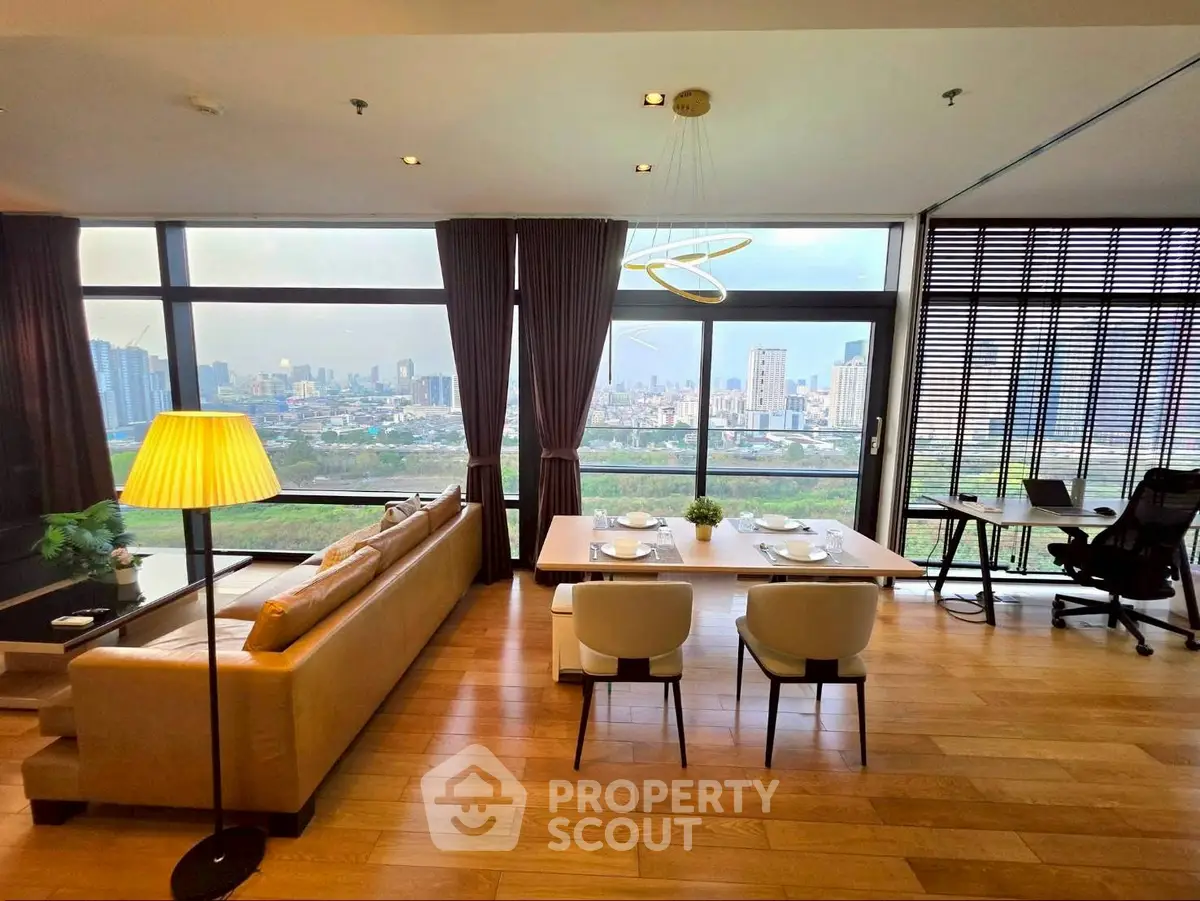 Luxurious living room with stunning city view, elegant dining area, and modern decor in high-rise apartment.