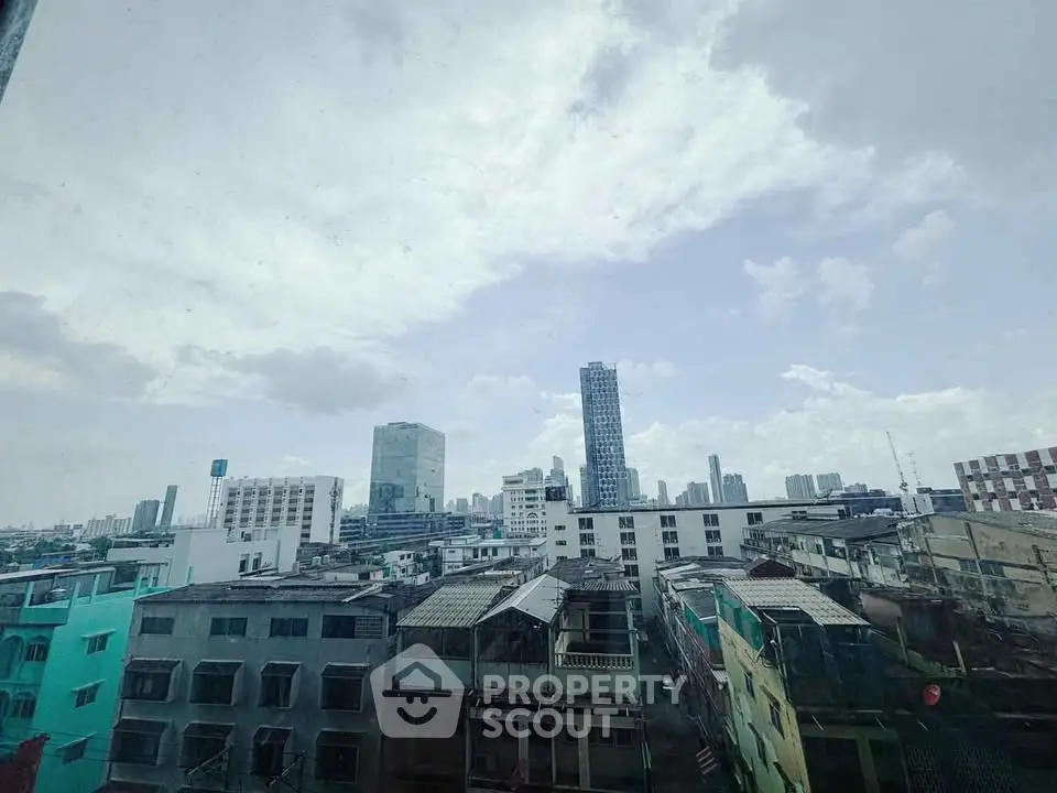 Stunning cityscape view from a high-rise building, showcasing urban skyline and architecture.