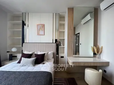 Modern bedroom with stylish decor and built-in shelving