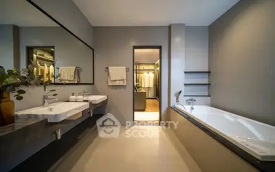 Luxurious modern bathroom with dual sinks and spacious bathtub