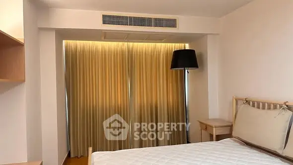 Cozy bedroom with elegant lighting and minimalist decor