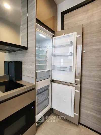 Modern kitchen with built-in fridge and sleek appliances