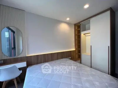 Modern bedroom with stylish decor and built-in wardrobe