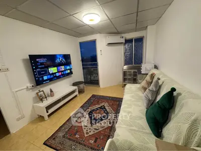 Cozy living room with modern TV setup and stylish decor