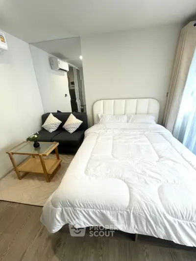 Modern bedroom with cozy bed and stylish decor in a bright apartment