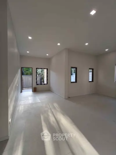 Spacious modern living room with high ceilings and natural light
