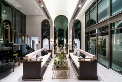 Luxurious modern living room with high ceilings and elegant decor