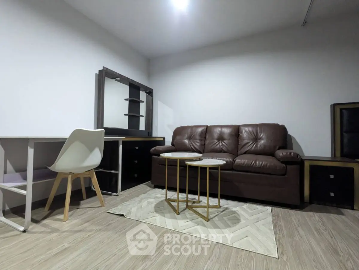 Modern living room with brown leather sofa and stylish furniture