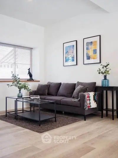 Modern living room with stylish decor and cozy seating area, perfect for relaxation and entertaining.