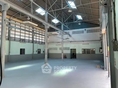 Spacious industrial warehouse with high ceilings and ample natural light