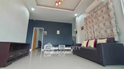 Spacious modern living room with elegant decor and ample natural light